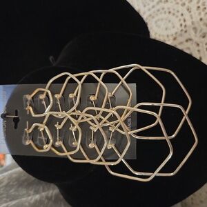 6 variety size silver colored earrings